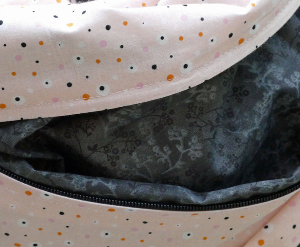 Salmon scarf with polka dot pattern