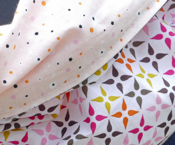 Salmon scarf with polka dot pattern