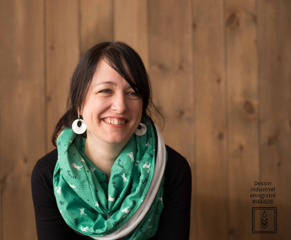 Green infinity scarf with white and dark blue patterns