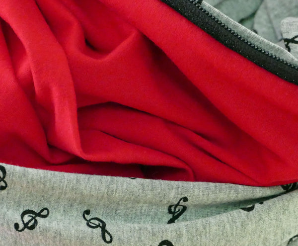 Infinity scarf in gray bamboo with treble clef patterns
