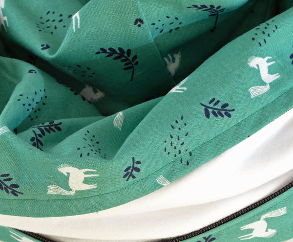 Green infinity scarf with white and dark blue patterns