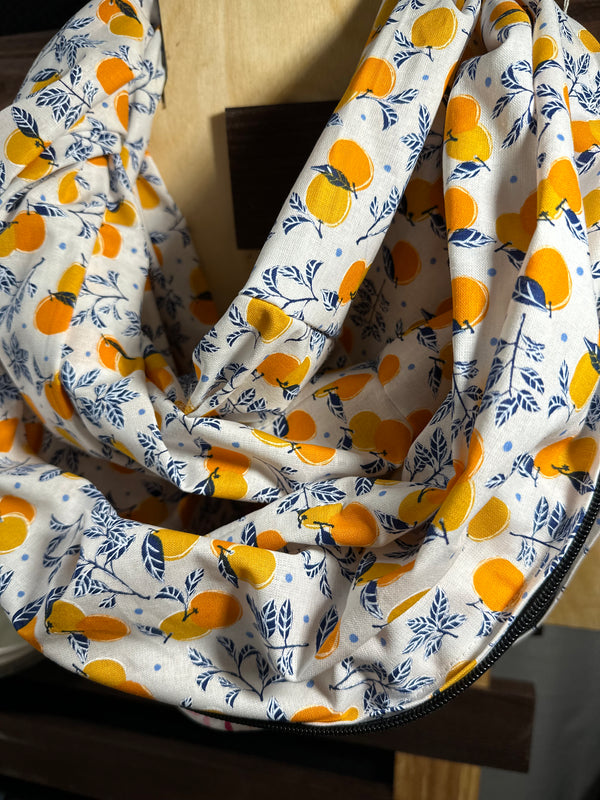 White scarf with orange patterns